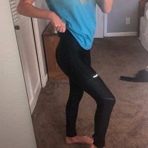 2 pairs of black Nike leggings